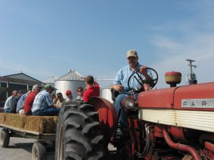 Customers get an old fashioned hay ride to the Agrigold Test Plot.